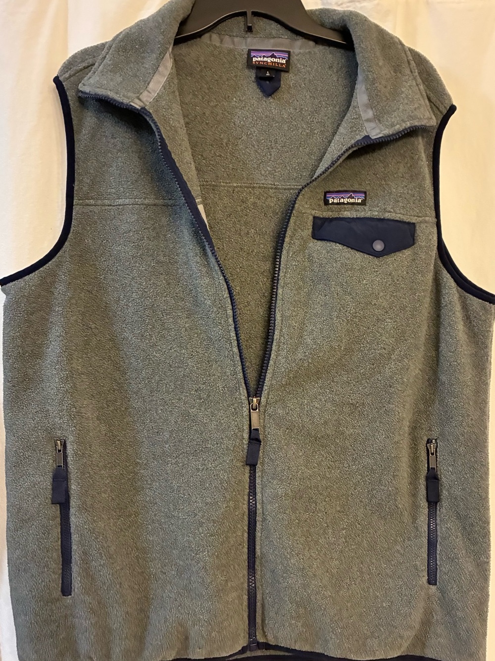 Men’s Patagonia Synchilla Vest, Grey with Blue Trim. 2 Left pockets.  Size Large